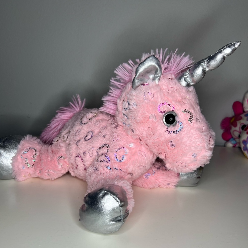 Pink and silver stuffed unicorn with hearts
